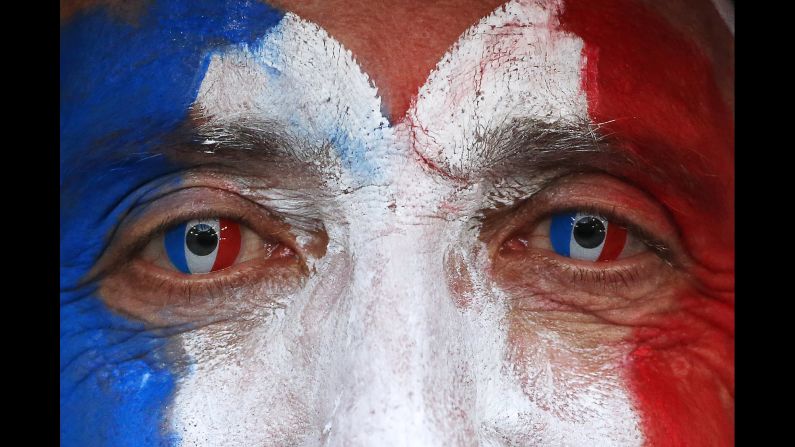 A France fan is ready before the match.