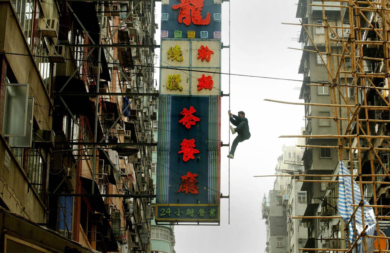 <strong>Neon lights, Mong Kok: </strong>Hong Kong's neon lights flourished in the post-war decades, layers upon layers of them lining the city's thoroughfares and roads. Today they're disappearing fast, being replaced by more energy-efficient LED lights. Veteran bamboo scaffolders are able to deftly navigate these heights. 