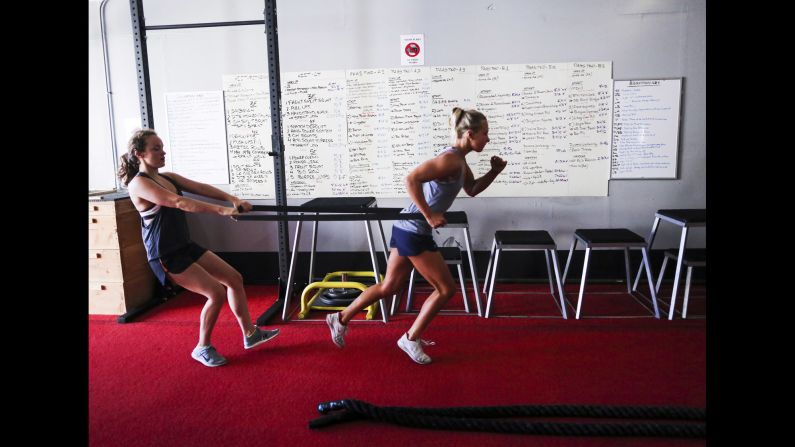 Koroleva, right, does exercises with U.S. team member Phoebe Coffin.