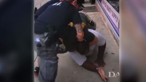 An NYPD officer puts Eric Garner in a prohibited chokehold.
