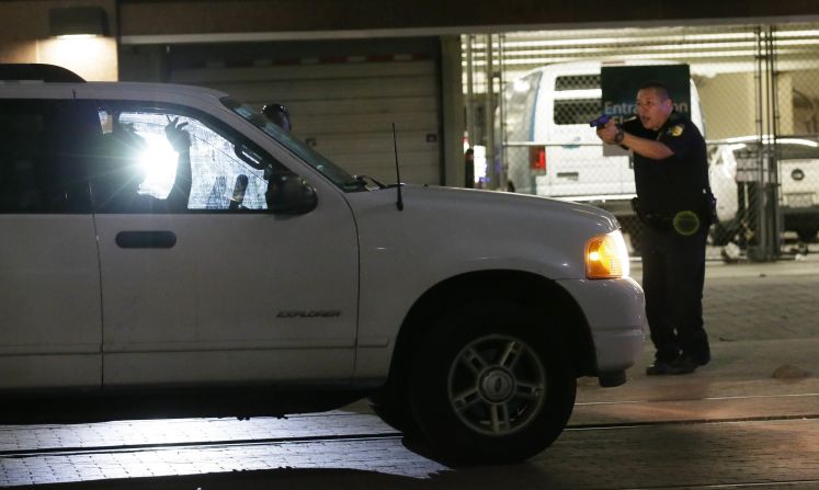 Police stop a driver in downtown Dallas.