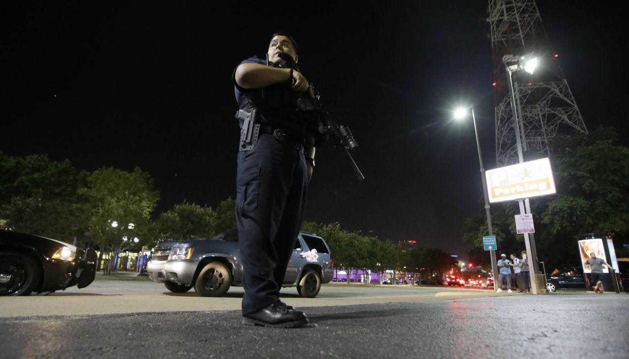 Dallas police stand watch after the shootings.