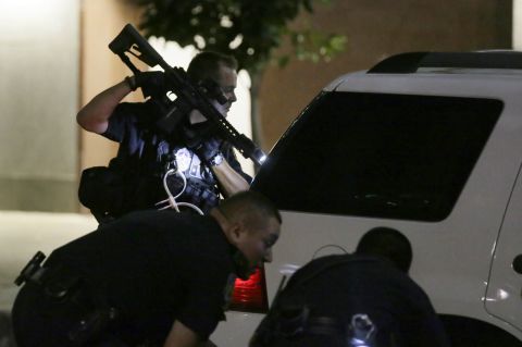 Dallas police check a car after detaining a driver.