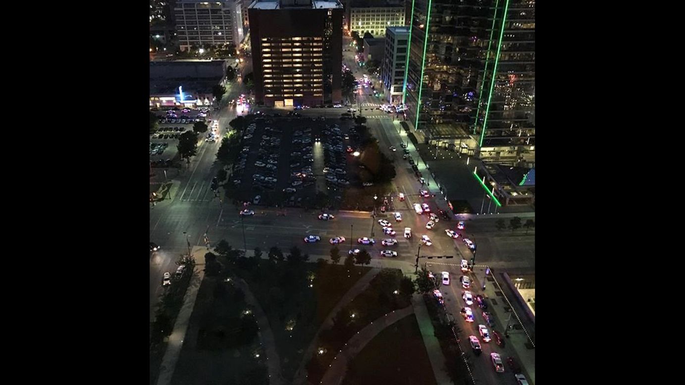 A view of downtown Dallas after the shootings. Kent Giles captured the image and told CNN he "heard multiple shots being fired. Probably more than 20 rounds. This is the intersection of Main and Griffin looking towards the west."