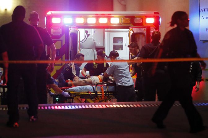 Emergency responders administer CPR to an unknown patient near the receiving area of the Baylor University Medical Center.