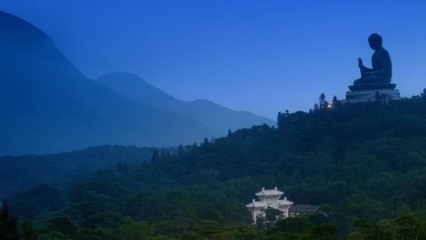 HONG KONG - 2013/10/10: The Big Buddha on the hill in the evening right after sundown. (Photo by Jonas Gratzer/LightRocket via Getty Images)
