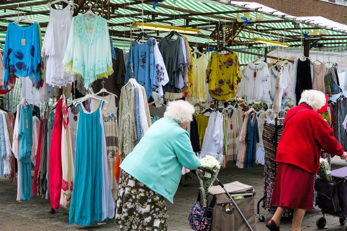 Eldery shooppers peruse the goods at Romford Market.