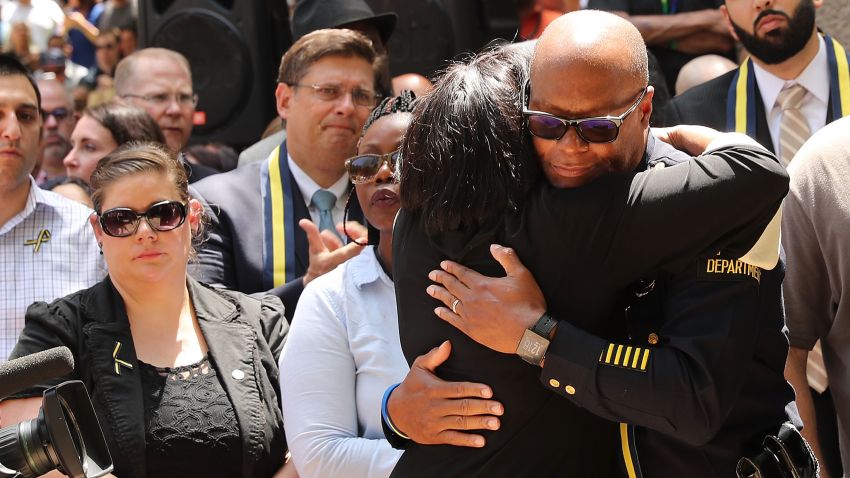 Dallas Police Chief David Brown is greeted with a hug at a prayer vigil following the deaths of five police officers last night during a Black Live Matter march on July 8, 2016 in Dallas, Texas. Five police officers were killed and seven others were injured  in a coordinated ambush at a anti-police brutality demonstration in Dallas. Investigators are saying the suspect is 25-year-old Micah Xavier Johnson of Mesquite, Texas. This is the deadliest incident for U.S. law enforcement since September 11.