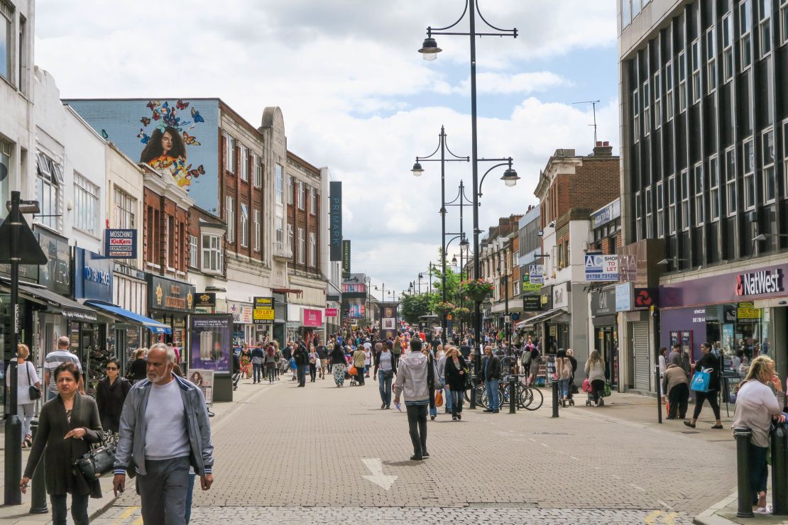 Saturday morning shoppers stream down Romford's high street. 