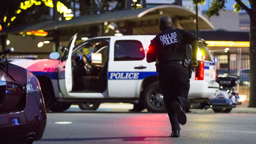 Dallas Police respond after shots were fired at a Black Lives Matter rally in downtown Dallas on Thursday, July 7, 2016. Dallas protestors rallied in the aftermath of the killing of Alton Sterling by police officers in Baton Rouge, La. and Philando Castile, who was killed by police less than 48 hours later in Minnesota. (Smiley N. Pool/The Dallas Morning News) -- MANDATORY CREDIT, NO SALES, MAGS OUT, TV OUT, INTERNET USE BY AP MEMBERS ONLY