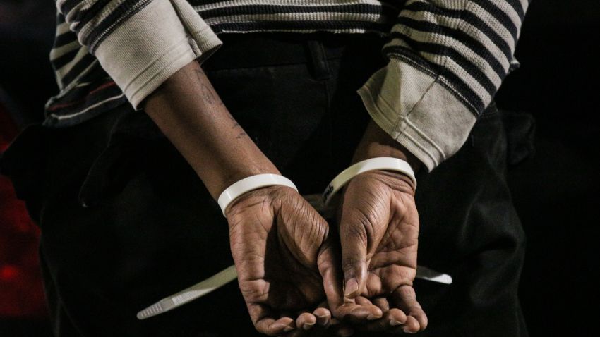 OAKLAND, CA - DECEMBER 13: The hands of a black protester are seen following his arrest at a 'Millions March' demonstration protesting the killing of unarmed black men by police on December 13, 2014 in Oakland, California. The march was one of many held nationwide. (Photo by Elijah Nouvelage/Getty Images)