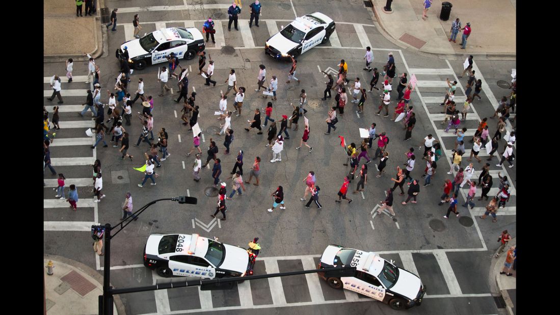 A peaceful Black Lives Matter rally moves through downtown Dallas on Thursday, July 7. Smiley Pool, a photographer with The Dallas Morning News, said what came near the beginning of the demonstration was a scene much different than what came hours later.