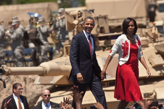 U.S. President Barack Obama and first lady Michelle Obama walk on stage at Fort Stewart Army post on April 27, 2012, in Hinesville, Georgia. This was Obama's first trip to Fort Stewart, where he met with soldiers and their families.