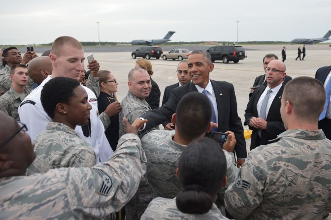 US President Barack Obama greets military personnel upon arrival at MacDill Air Force Base in Tampa, Florida, on September 16, 2014.
