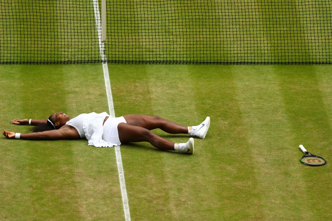 Williams lies on the ground after clinching her victory against Kerber to win Wimbledon for the seventh time.  