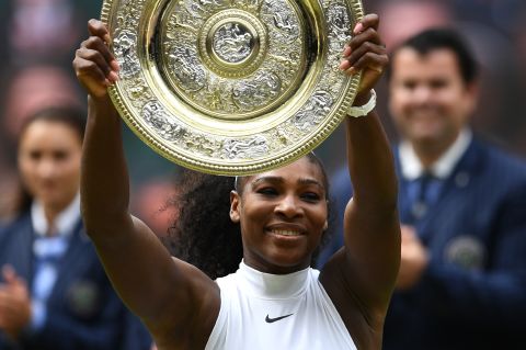 Serena Williams poses with the Venus Rosewater Dish after her women's singles final victory over Germany's Angelique Kerber. 