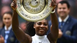 Serena Williams poses with the Venus Rosewater Dish after her women's singles final victory over Germany's Angelique Kerber.