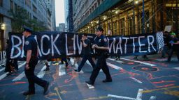 Police officers patrol during a protest in support of the Black Lives Matter movement in New York on July 09, 2016.