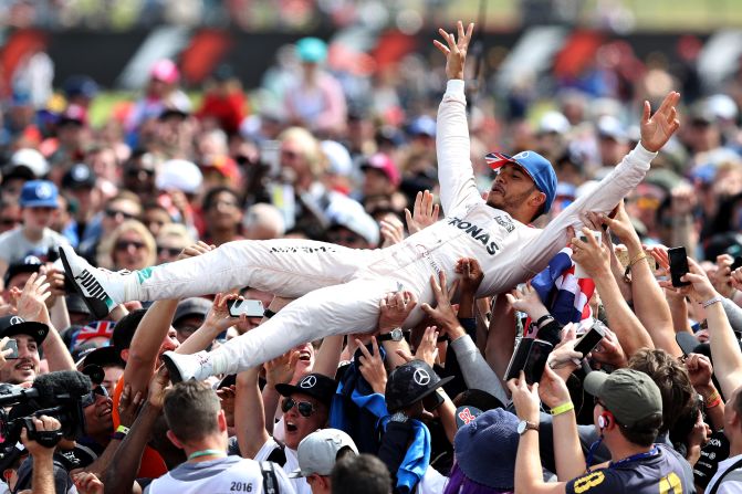 Time for a spot of crowd-surfing after <a href="index.php?page=&url=http%3A%2F%2Fcnn.com%2F2016%2F07%2F10%2Fmotorsport%2Fbritishgp-hamilton-rosberg-verstappen%2F" target="_blank">a perfect drive for Hamilton at his home track, Silverstone.</a> Rosberg was relegated to third after being told how to solve a gearbox problem over the team radio, breaking rules governing in-race communications -- which were subsequently lifted.