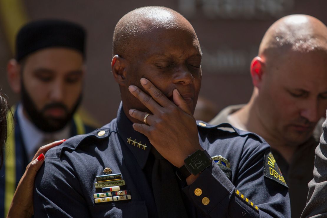 Dallas Police Chief David Brown prays during a vigil July 8 