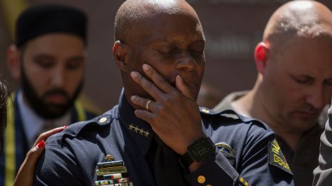 Dallas Police Chief David Brown prays during a vigil July 8