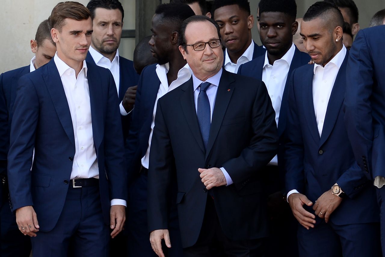 Instead, during a meeting with French President Francois Hollande, the players were forced put on a brave face. Antoine Griezmann (left) had earlier collected his golden boot award without registering a smile. The 25-year-old Atlético Madrid striker was also named Player of the Tournament Monday, having scored six goals. 