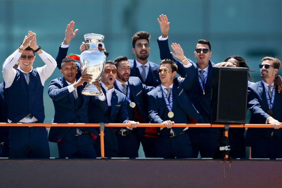 An open-top bus paraded the stars through the streets of Lisbon as the players showed off the trophy -- the nation's first at a major football tournament, and some consolation after losing the 2004 final on home soil. 