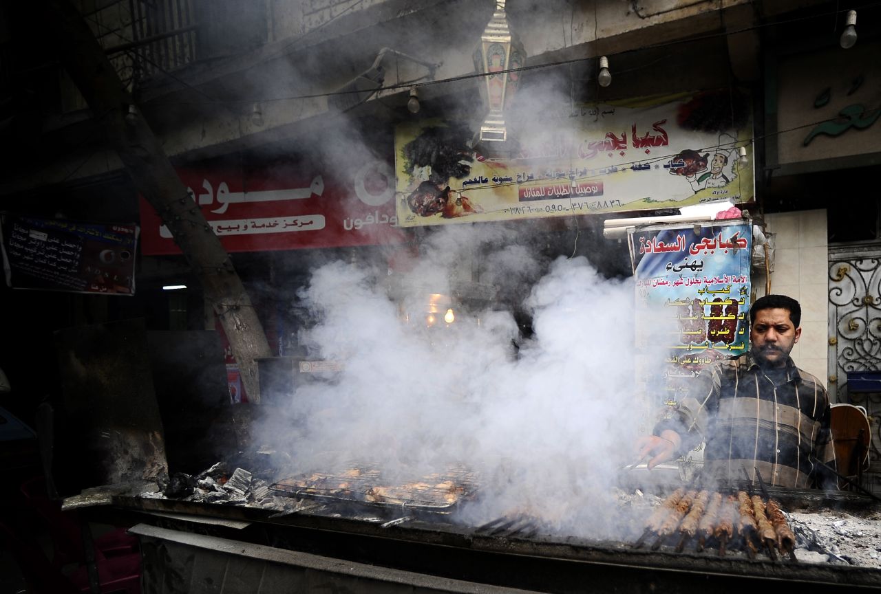 "Bad diets are a big problem affecting all countries. We estimate that one in three people has a poor diet," says lead author, Dr Lawrence Haddad, executive director at the Global Alliance for Improved Nutrition (GAIN).<br /><br />Pictured here, a street food vendor cooks kebabs in downtown Cairo, Egypt. 