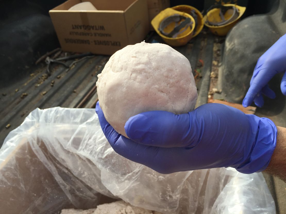 Explosive expert Matt Barnett holds a pound of C-4.