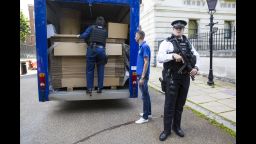 A moving van loaded with cardboard boxes is inspected by police before entering Downing Street on July 12, 2016 in London, England. 