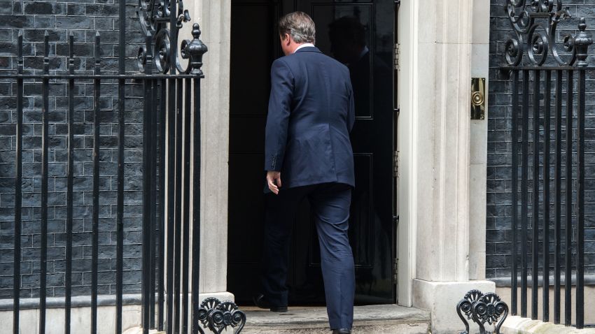 British Prime Minister David Cameron walks back into 10 Downing Street in London on July 11, 2016, after announcing to the media that Theresa May would be Britain's new leader. 
Theresa May will become Britain's new leader on Wednesday, Prime Minister David Cameron said on Monday after her sole rival pulled out of a leadership race. / AFP / CHRIS J RATCLIFFE        (Photo credit should read CHRIS J RATCLIFFE/AFP/Getty Images)
