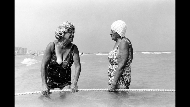 Women hold a rope at the 10th Street beach in Florida in 1980. Leica camera in hand, <a href="index.php?page=&url=http%3A%2F%2Fwww.garymonroe.net%2F" target="_blank" target="_blank">Gary Monroe</a> spent about a decade photographing life in South Beach. "The camera was seen very differently then," he said. "Everything was open to me, and I was welcomed to photograph."