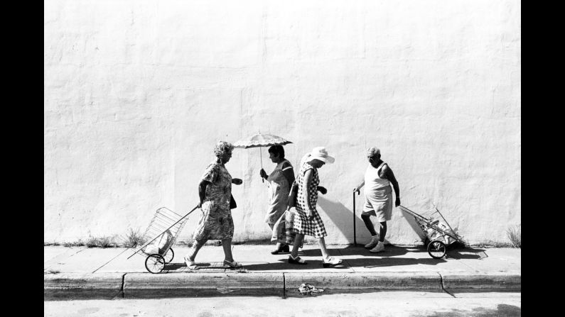 People walk along Sixth Street, off Washington Avenue, in 1978. The South Beach the photographer shows us -- from 1977 through 1986 -- is a much different place than the one we know today. Monroe's images take us into the lives of the elderly Jewish community at the time, many of whom were survivors of the Holocaust and Czarist pogroms -- organized massacres of Jewish people. "I didn't work with an agenda," Monroe said. "I was giving form to my intuitions, making photographs on a deep breath and a prayer, so to speak."