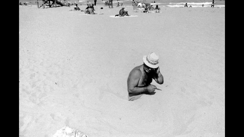A man sits in the sand at the Lummus Park beach in 1980. Although Monroe made thousands of prints, he selected only a few to include in his "<a href="index.php?page=&url=http%3A%2F%2Fwww.lisastonearts.com%2Fgallery-store.html" target="_blank" target="_blank">Life in South Beach</a>" photo book. "For whatever reason, I choose 18 because in Hebrew, the expression (often a toast) means 'to life,' " he said. "And I wanted to underscore, no matter how subtly, that idea. These people faced the worst of humanity and still, in old age even, lived life fully, with zest and optimism."