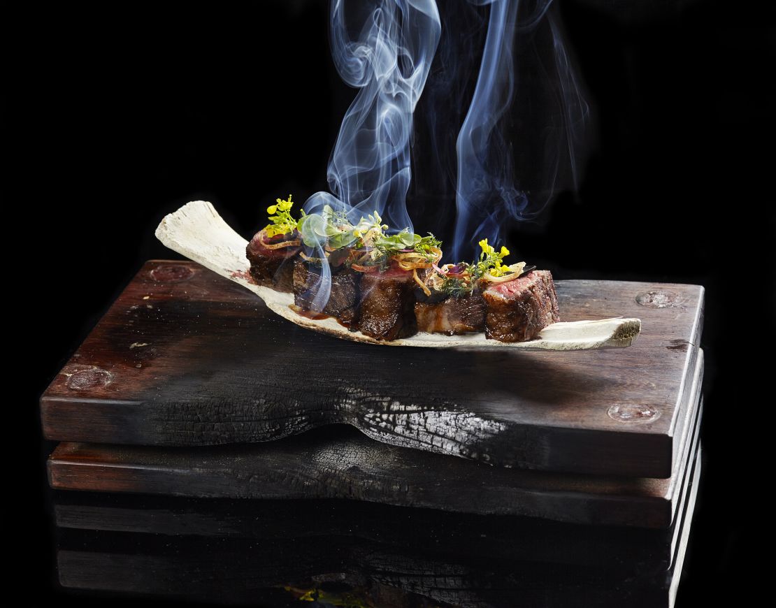 A beef dish at the Mandarin Oriental Hong Kong, topped with foraged flowers.