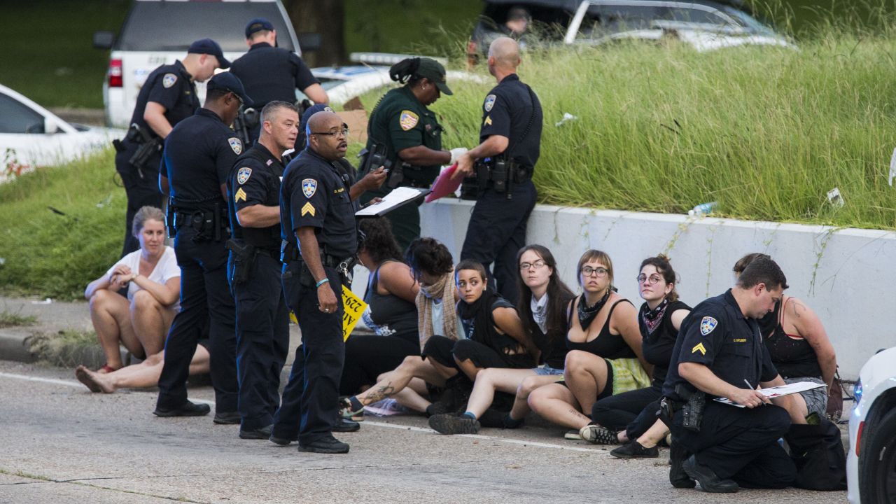 Protesters sit after being arrested after a march on July 10 in Baton Rouge, Louisiana. Many cities have seen an increase in protests since police-involved shootings.