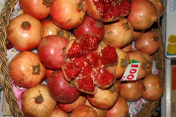 As a country's income goes up, people are in theory able to buy more healthy foods. <br />Pictured here, pomegranates at a market in Mauritius. 