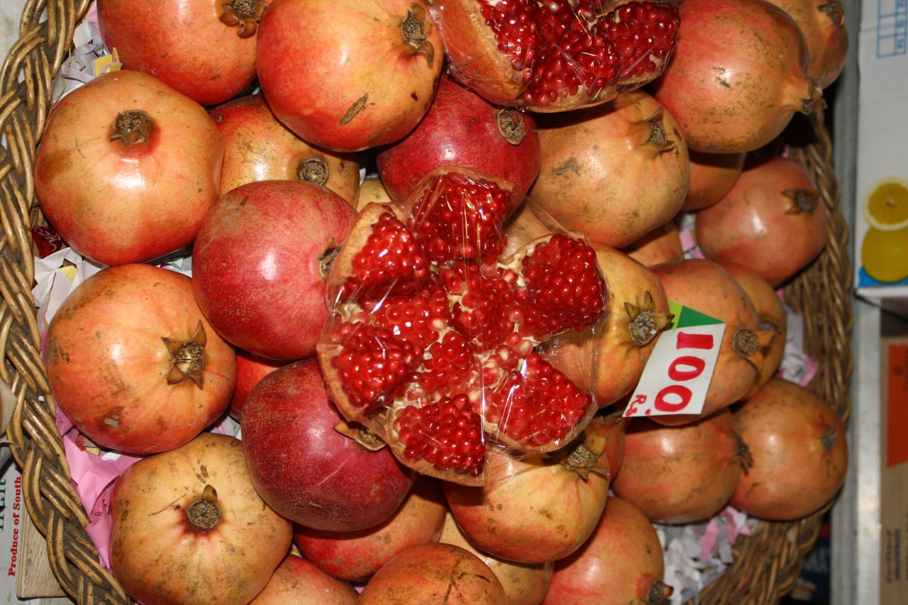 As a country's income goes up, people are in theory able to buy more healthy foods. <br />Pictured here, pomegranates at a market in Mauritius. 