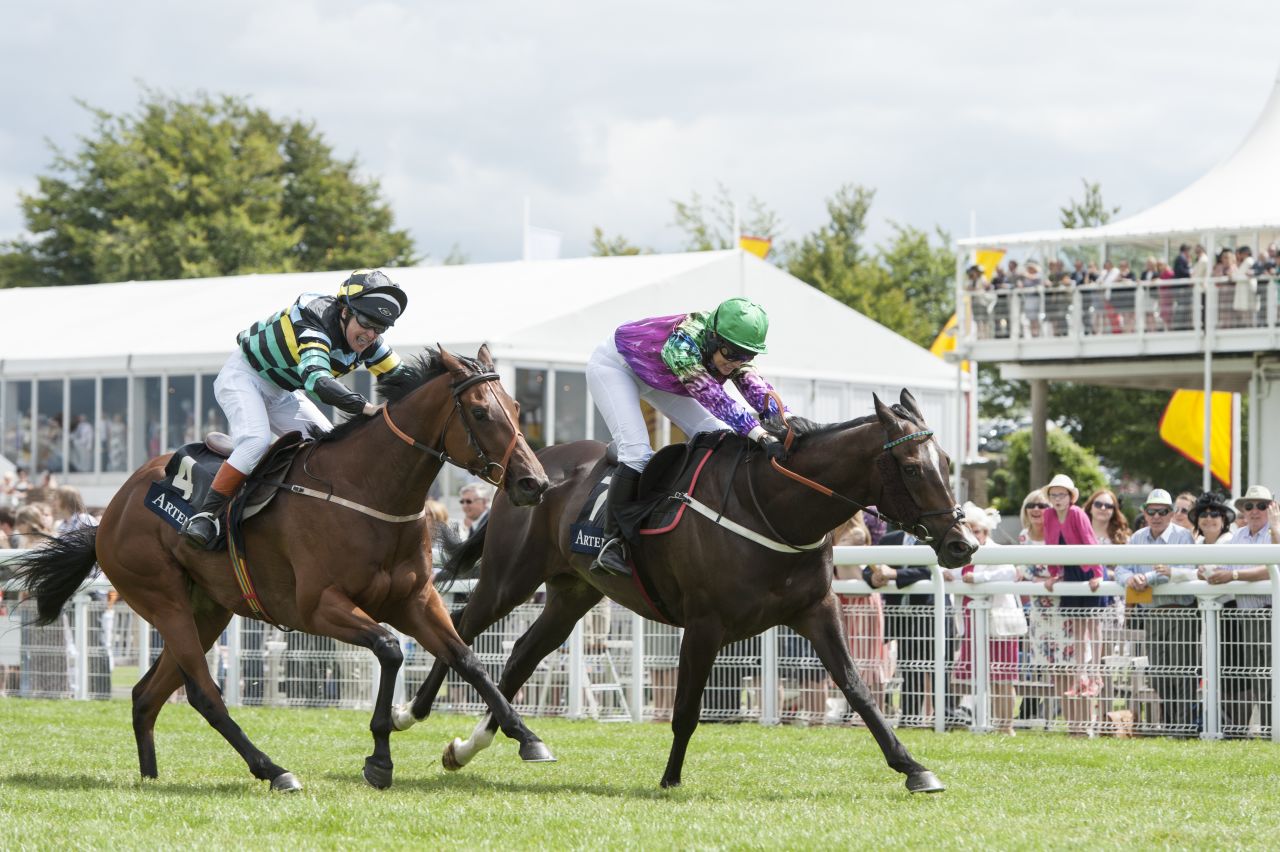 The charity race opens the festival's Ladies' Day, with the competitors racing in front of 40,000 spectators.