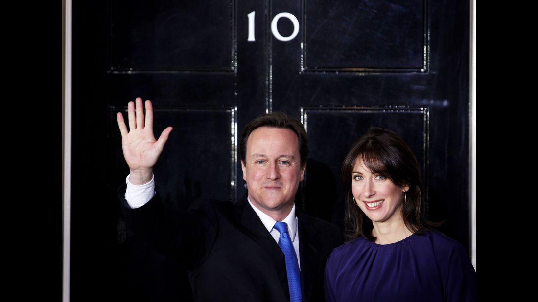 Cameron and his wife Samantha wave on the steps of Downing Street on May 11, 2010 after he took office.