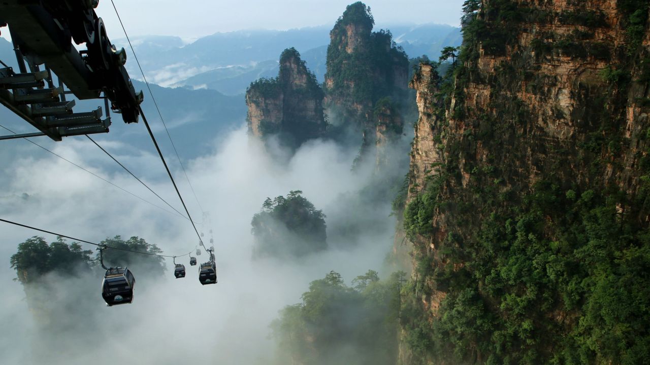China's Tianmen Shan cable car is one of the longest cable-car rides in the world, covering a distance of 7,455 meters (24,459 feet) and ascending to 1,279 meters (4,196 feet). The car runs from Zhangjiajie railway station up to the top of Tianmen Shan, which translates as Heaven's Gate Mountain.