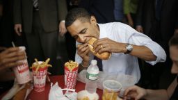 PHILADELPHIA - APRIL 22: Democratic presidential candidate Senator Barack Obama (D-IL) and his wife Michelle eat a cheesesteak and fries during a campaign stop at Pat's King of Steaks April 22, 2008 in Philadelphia, Pennsylvania. Voters in Pennsylvania go to the polls today. (Photo by Charles Ommanney/Getty Images)