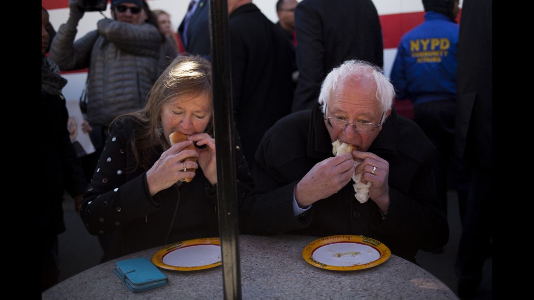 Sen. Bernie Sanders, an independent from Vermont and a 2016 Democratic presidential candidate (right), and his wife Jane ate Nathan's Famous hot dogs after a campaign event in Brooklyn on April 10, 2016. 