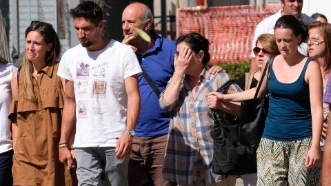 People arrive Wednesday at a Bari, Italy, hospital to identify bodies.