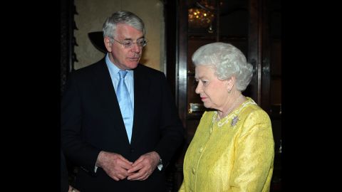 The Queen speaks with former Prime Minister John Major on March 12, 2012 in London.