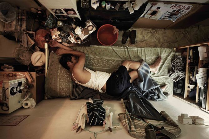 Hong Kong photographer Benny Lam created this series to illustrate the cramped quarters -- sometimes called "shoebox homes" -- for the city's poorest residents. "In the photos you can see the physical space," says Lam, "but if you could experience the smell and the temperature, you would feel like it was hell." 