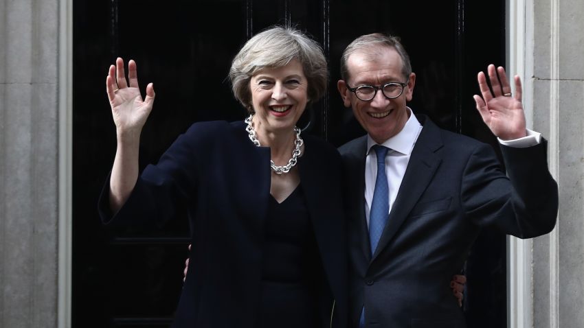 LONDON, ENGLAND - JULY 13: British Prime Minister Theresa May and husband Philip May wave outside 10 Downing Street on July 13, 2016 in London, England. Former Home Secretary Theresa May becomes the UK's second female Prime Minister after she was selected unopposed by Conservative MPs to be their new party leader. She is currently MP for Maidenhead. (Photo by Carl Court/Getty Images)