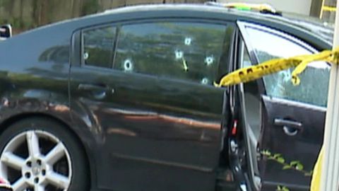 Their car was riddled with bullet holes.