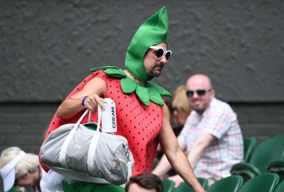Chris Fava,40, traveled 5,000 miles from California to attend the tournament, dressed as a giant strawberry complete with carton of cream. 