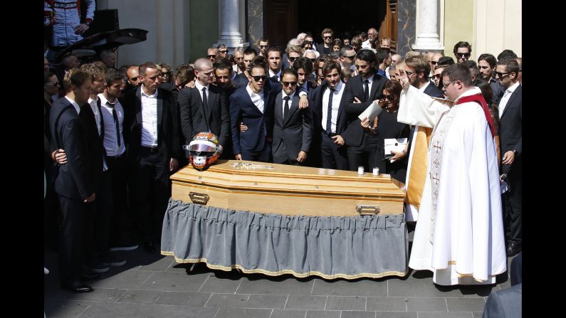 Family and friends of Bianchi, including fellow F1 drivers, stand by his coffin after his funeral at the Cathedrale Sainte Reparate in Nice on July 21, 2015 in southeastern France. Bianchi died in a hospital in his hometown of Nice from head injuries he sustained in the October 5, 2014 crash.
